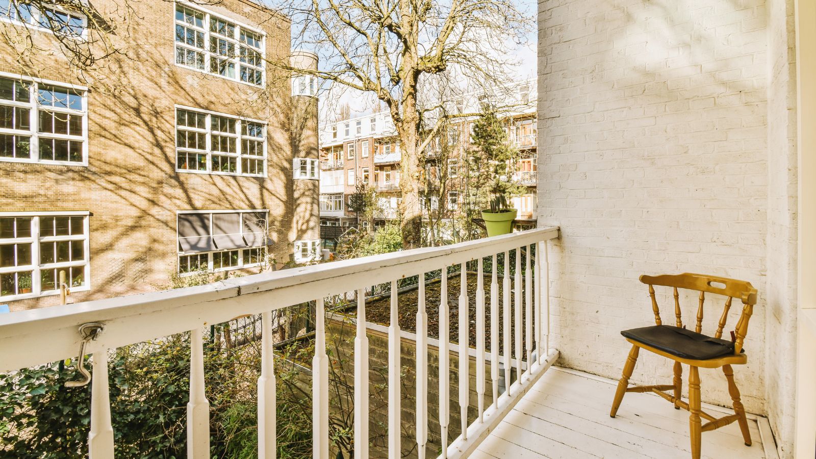 A photo of unused balcony dusty chairs