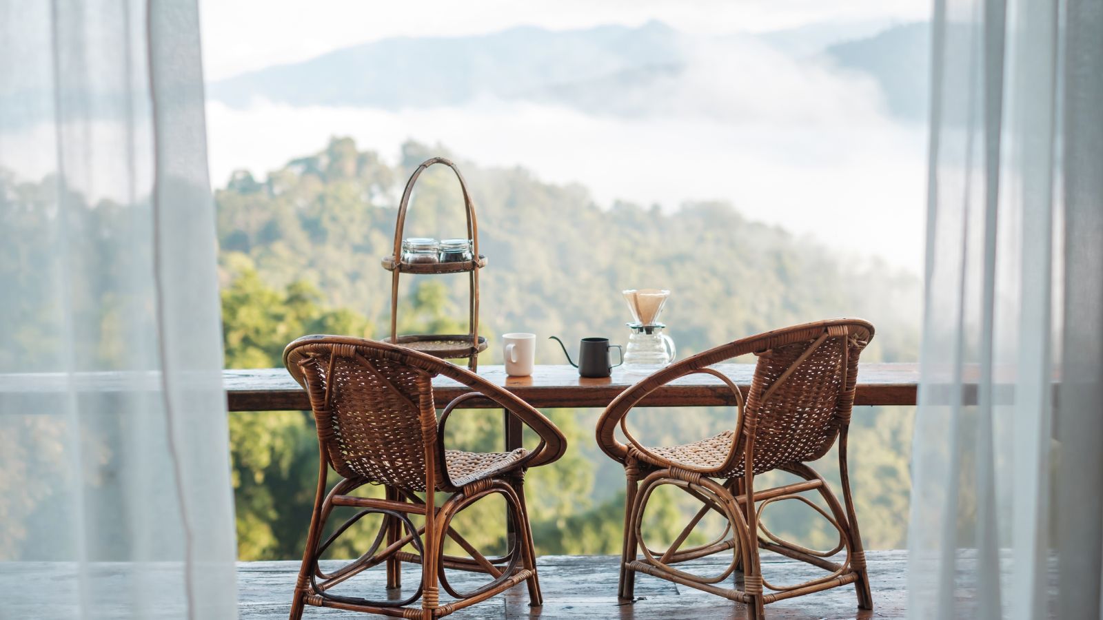 A photo of a unused balcony dusty chairs.