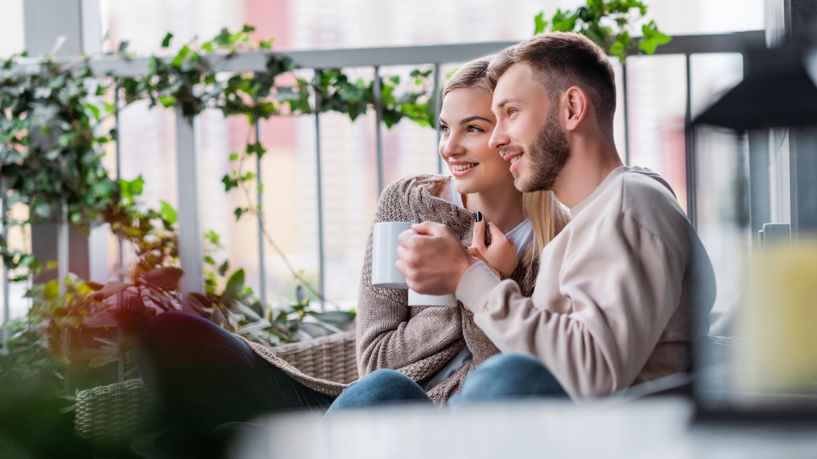 A photo of a Couple relaxed balcony morning.