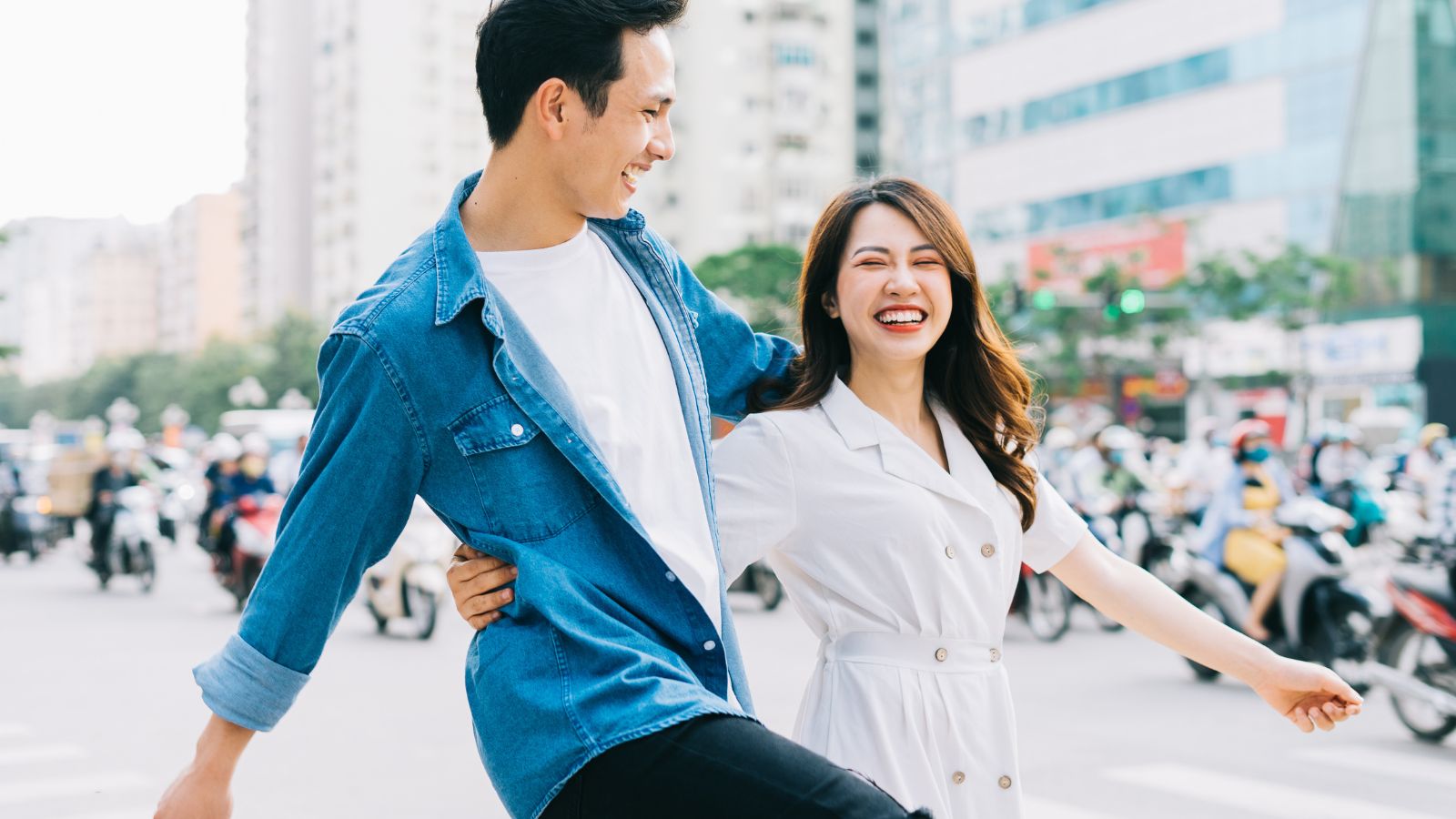A photo of a Couple walking spontaneous street.