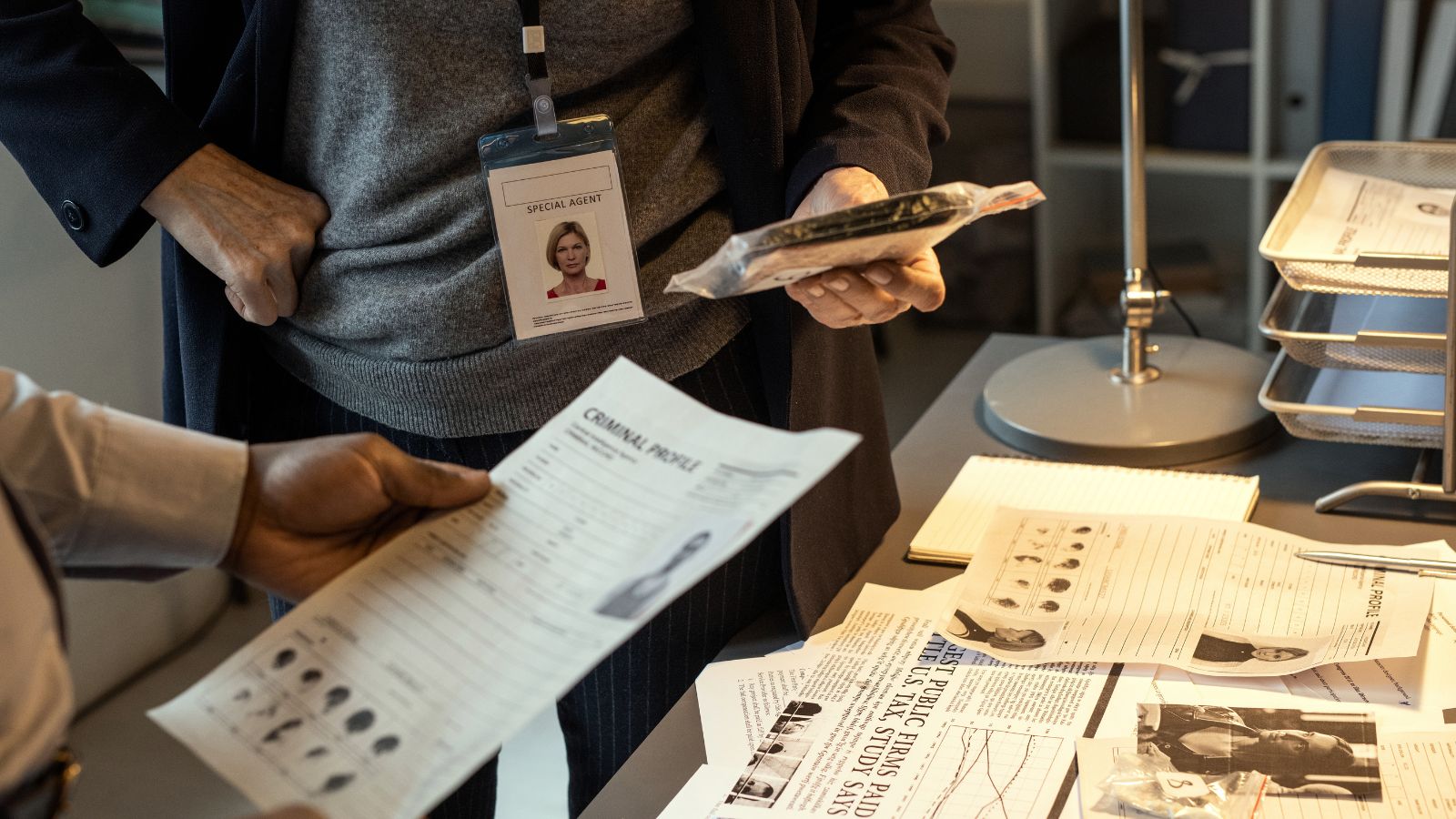 A photo of a Immigration officer checking documents.