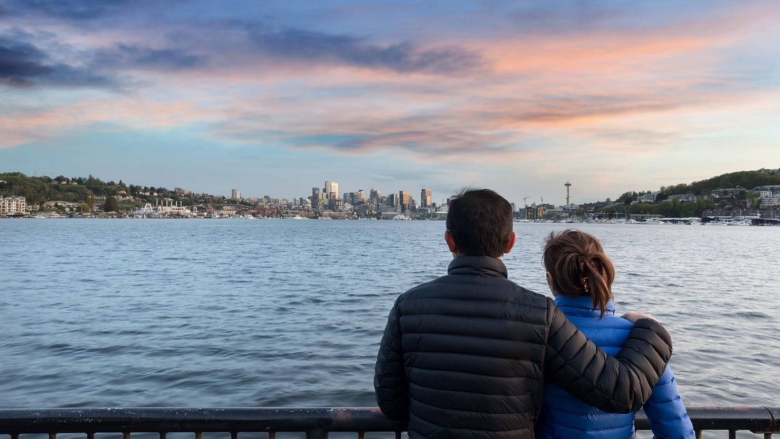 An image of a couple looking at the Seattle skyline.
