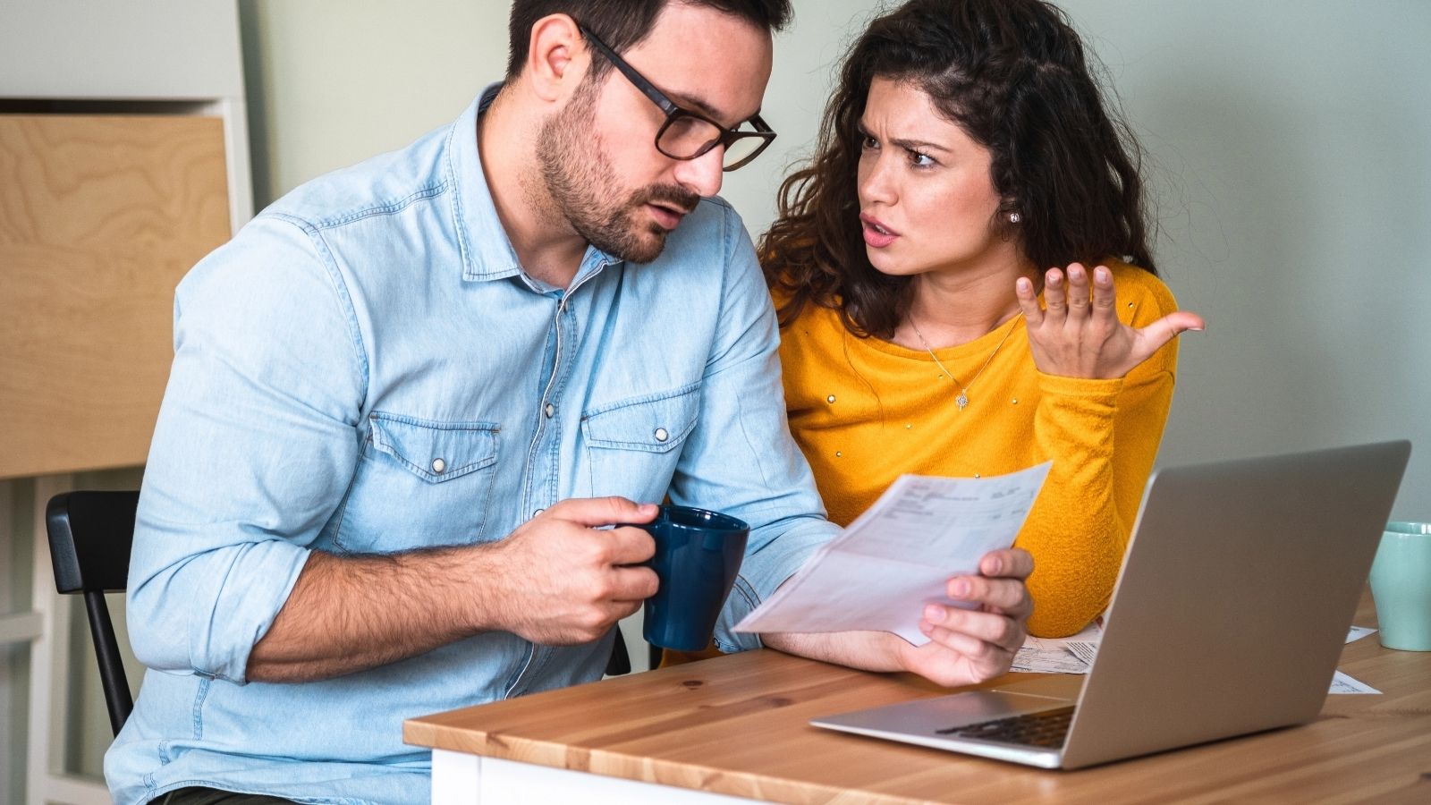Husband and wife fighting over money and expenses.