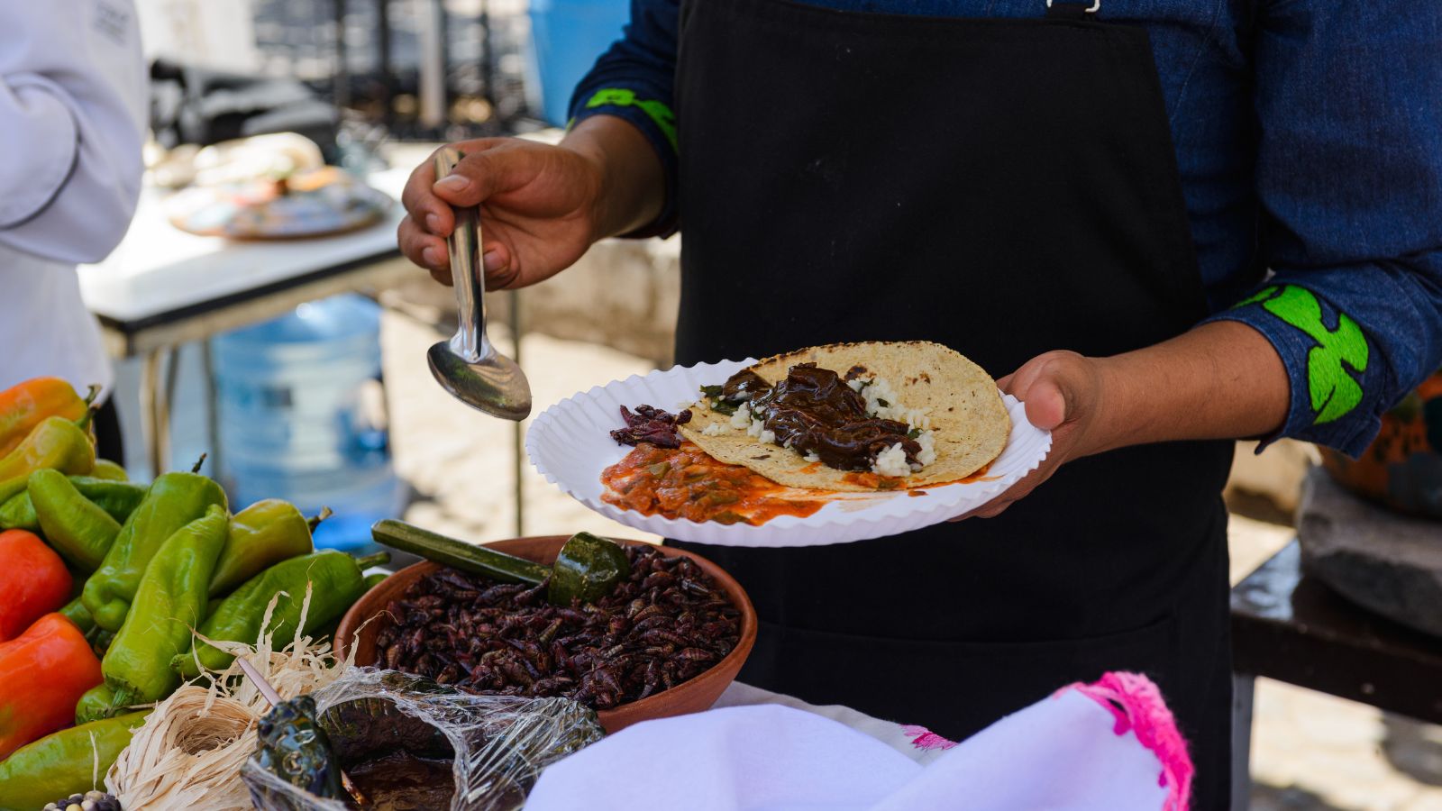 A photo of a man with a plate full of different dish.