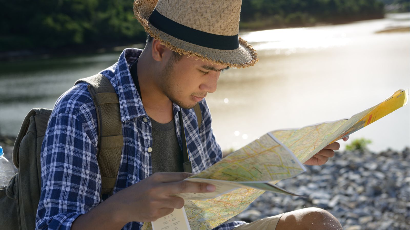 A photo of a man carefully surveying the map.
