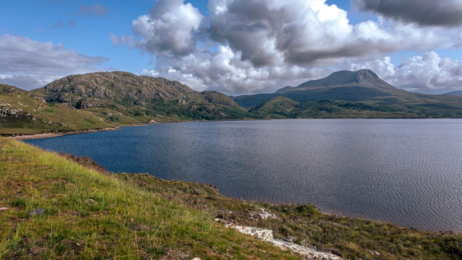 Driving on the scenic route North Coast 500, Scotland, near Loch Droma.