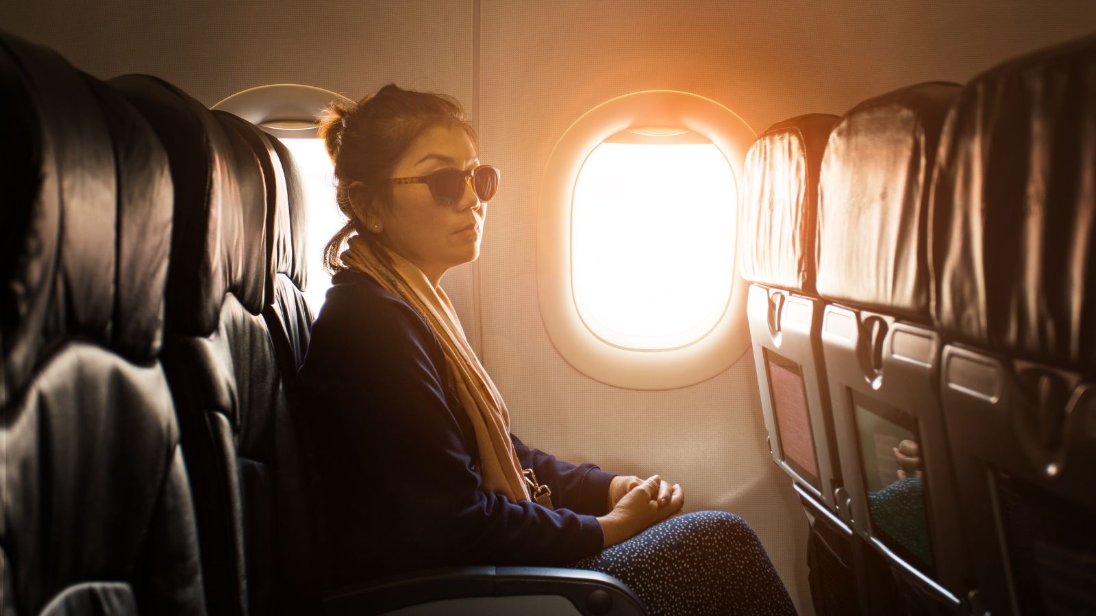 A photo of a Passenger relaxing comfortably on a direct flight.