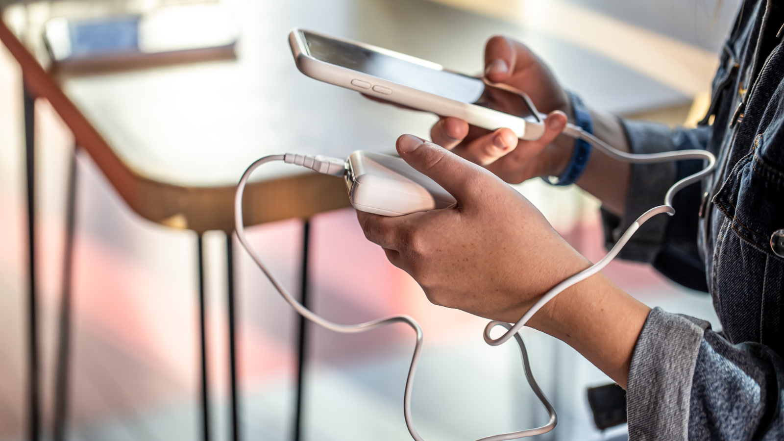 A photo of a woman holding a power bank.