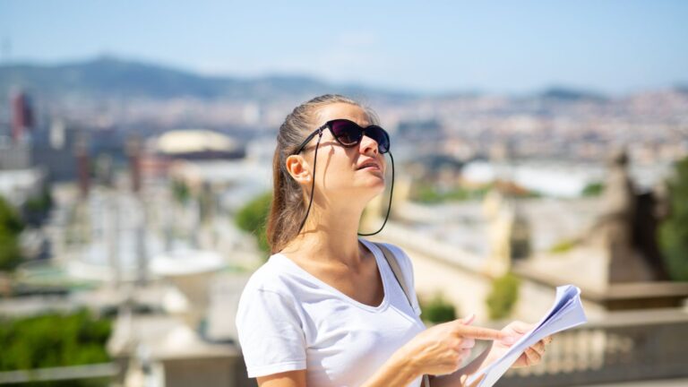 A photo of a woman looking around a foreign City.