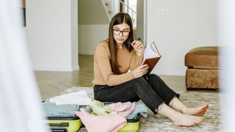 A photo of a Traveler looking overwhelmed while reviewing a tightly packed travel itinerary.