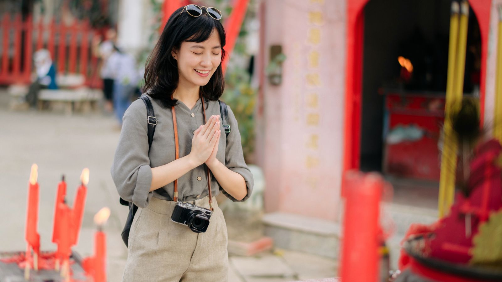 A photo of a Respectful traveler observing culture.