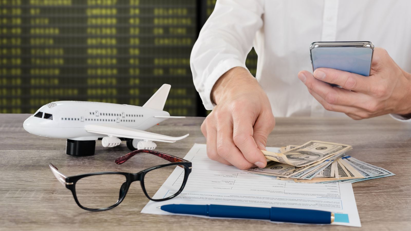 A photo of Traveler reviewing travel expenses.