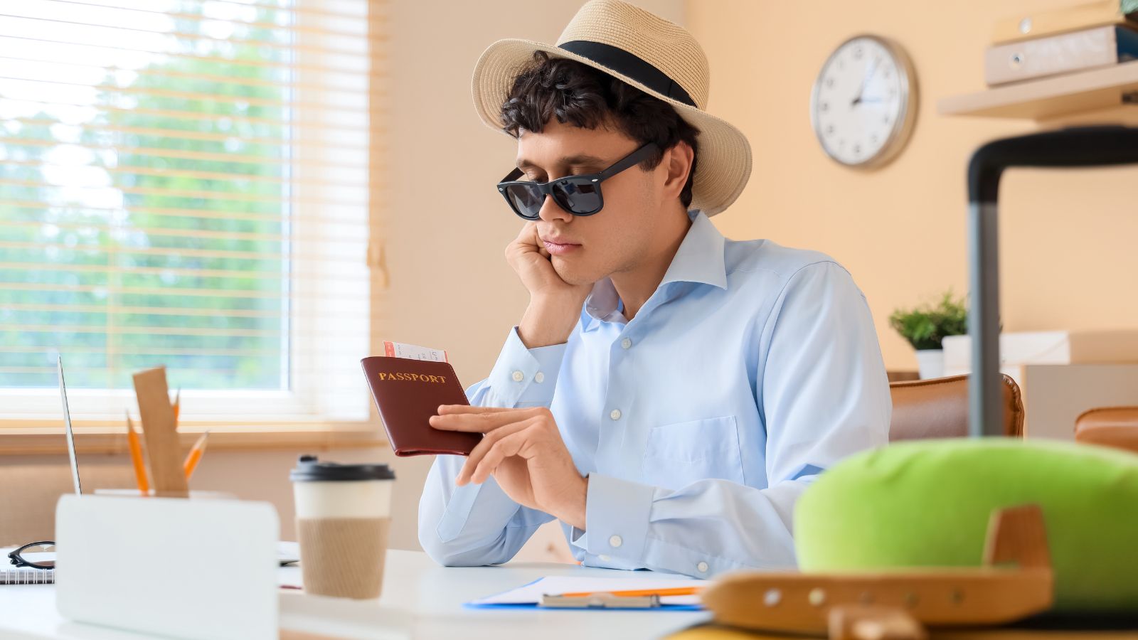 A photo of a Traveler reviewing passport and visa documents at a desk.