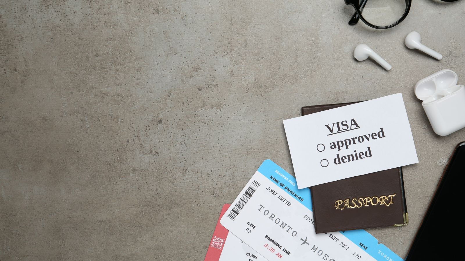 A photo of Neatly arranged passport, visa, tickets, and checklist.