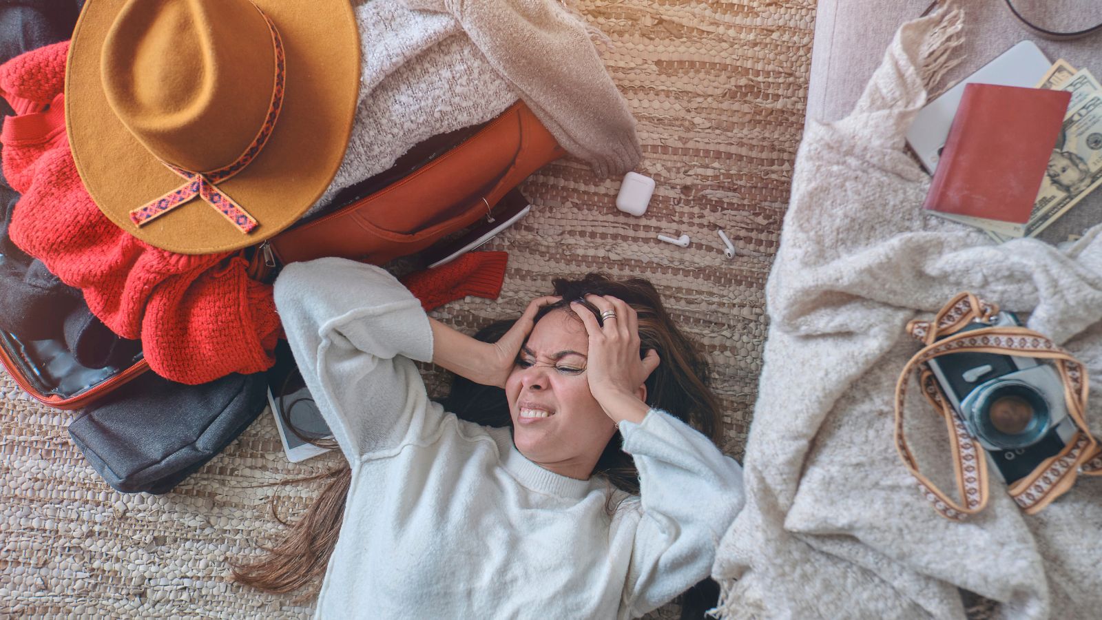 A picture that of a woman thinking about over planned itinerary.