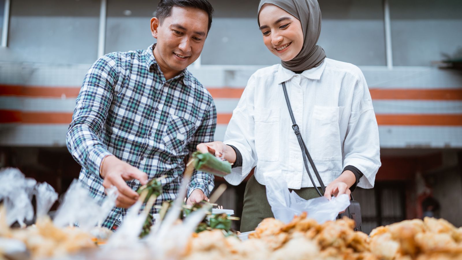 A photo of a couple laughing together local market.