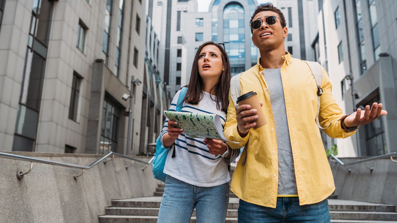 A photo of a couple navigating unfamiliar street.