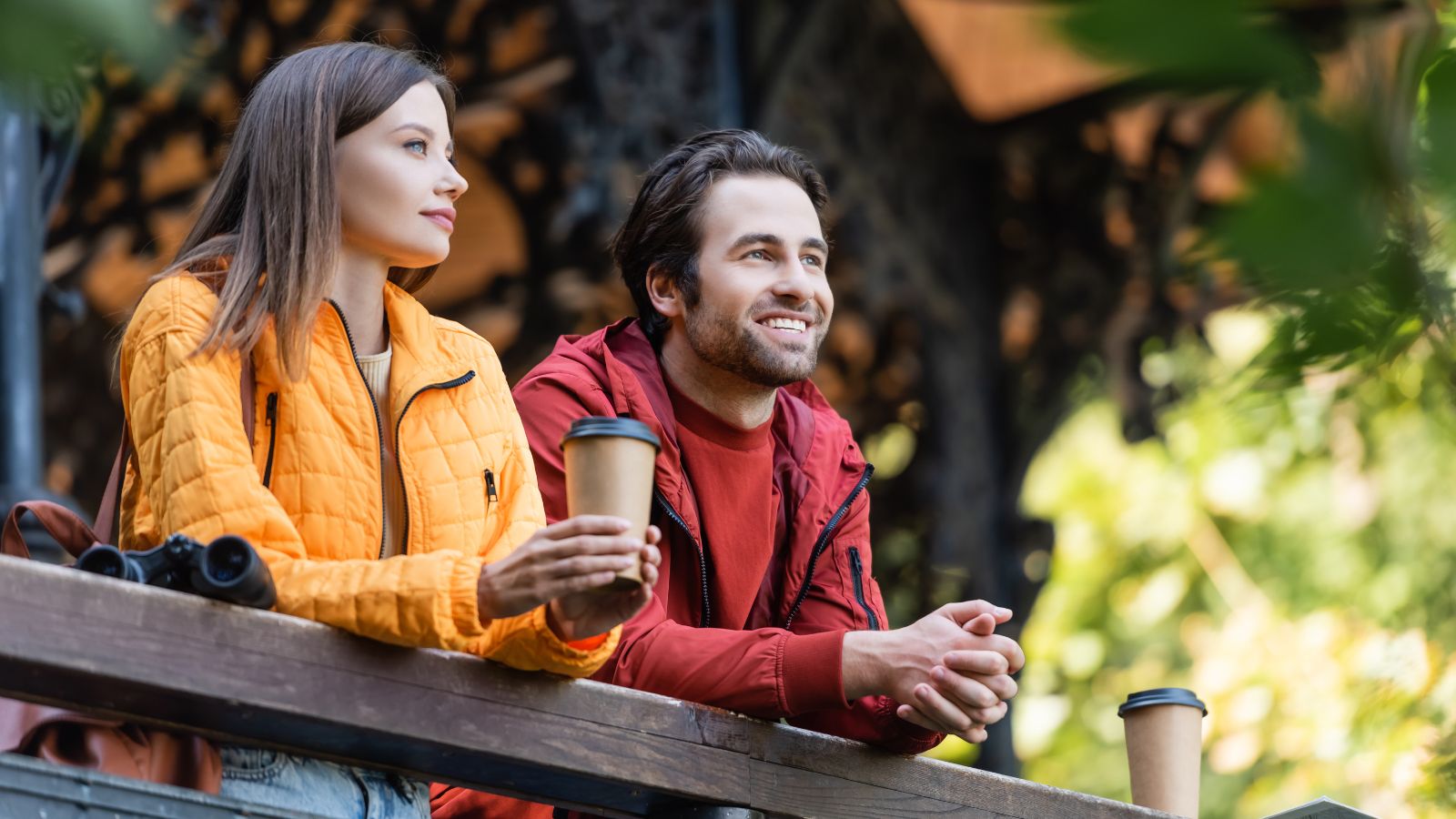 A photo of a couple with relaxed posture, no phones in hand, observing surroundings.