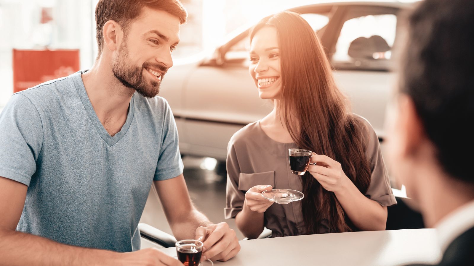 A photo of a Couple at a car rental counter during a Valentine’s weekend trip.
