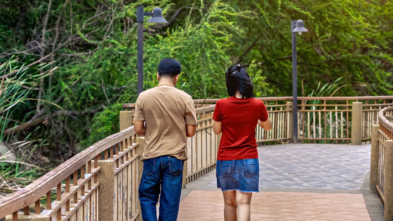 A photo of a couple enjoying a quiet scenic walk in a popular destination with minimal crowds.