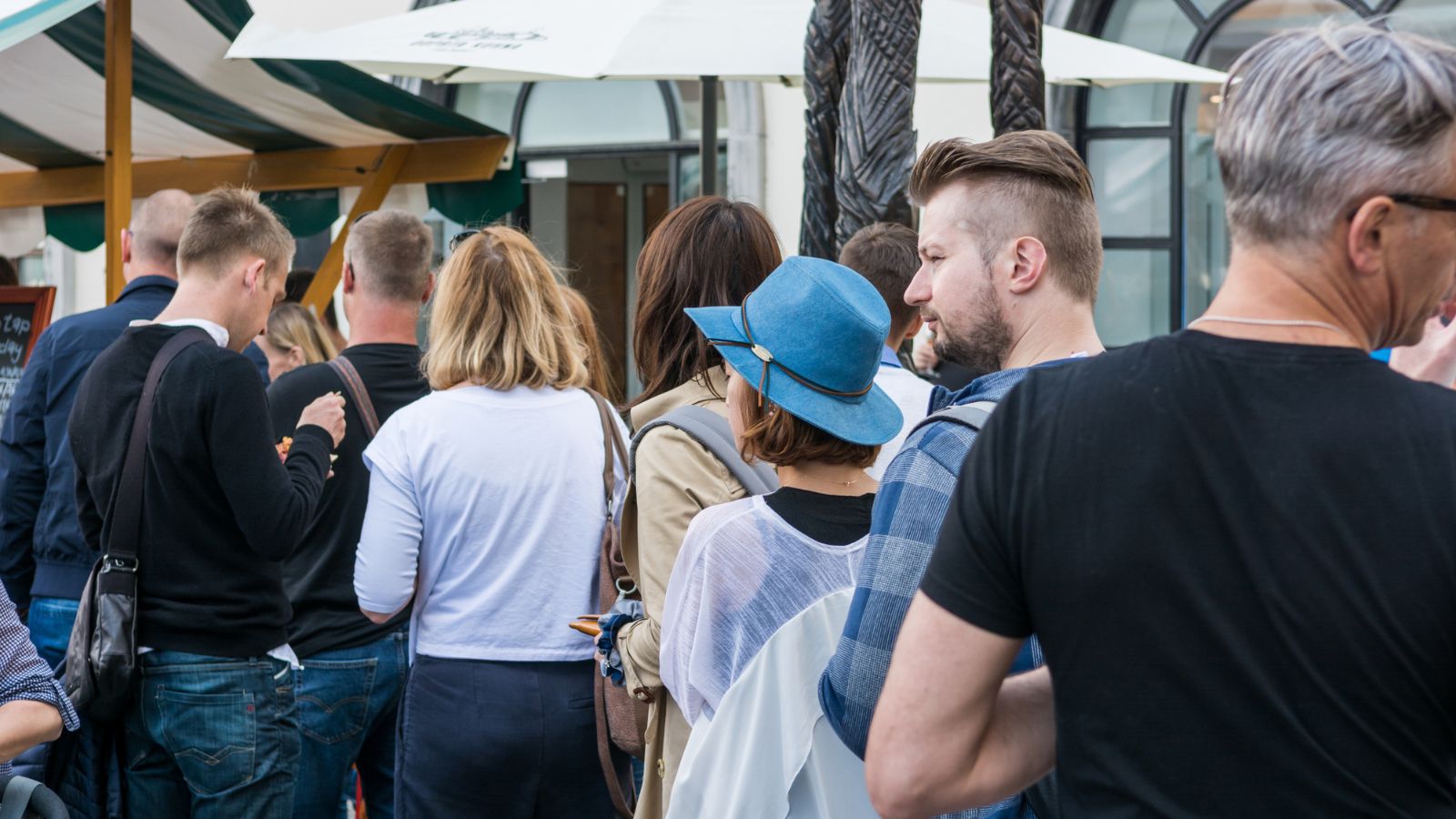 A photo of a long queue waiting mood.