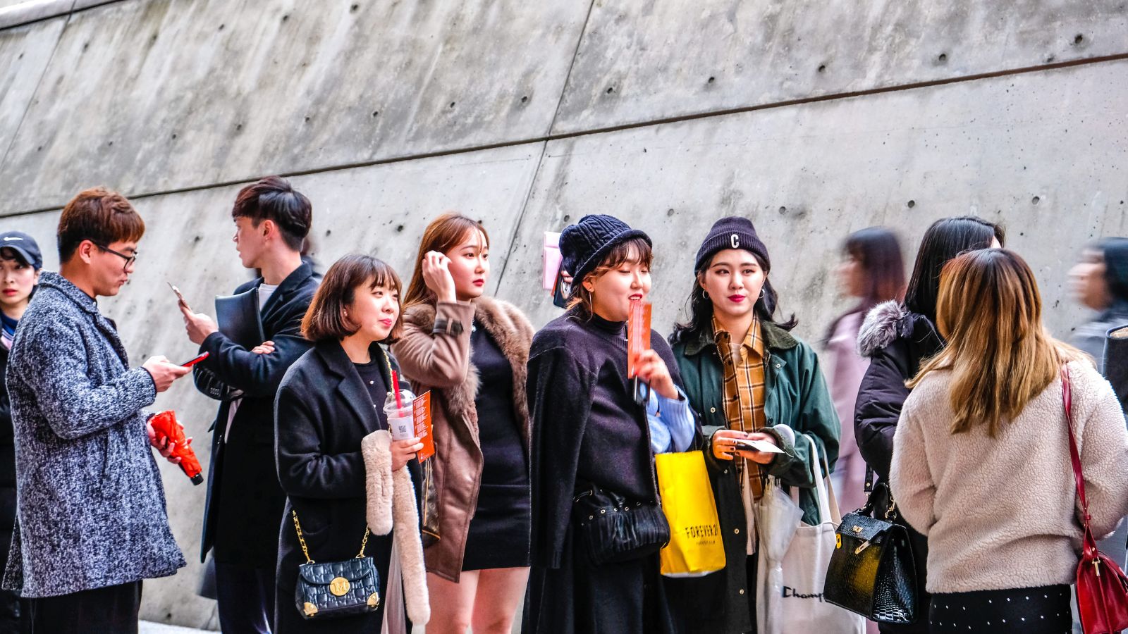 A photo that shows passengers crowding outside an area.