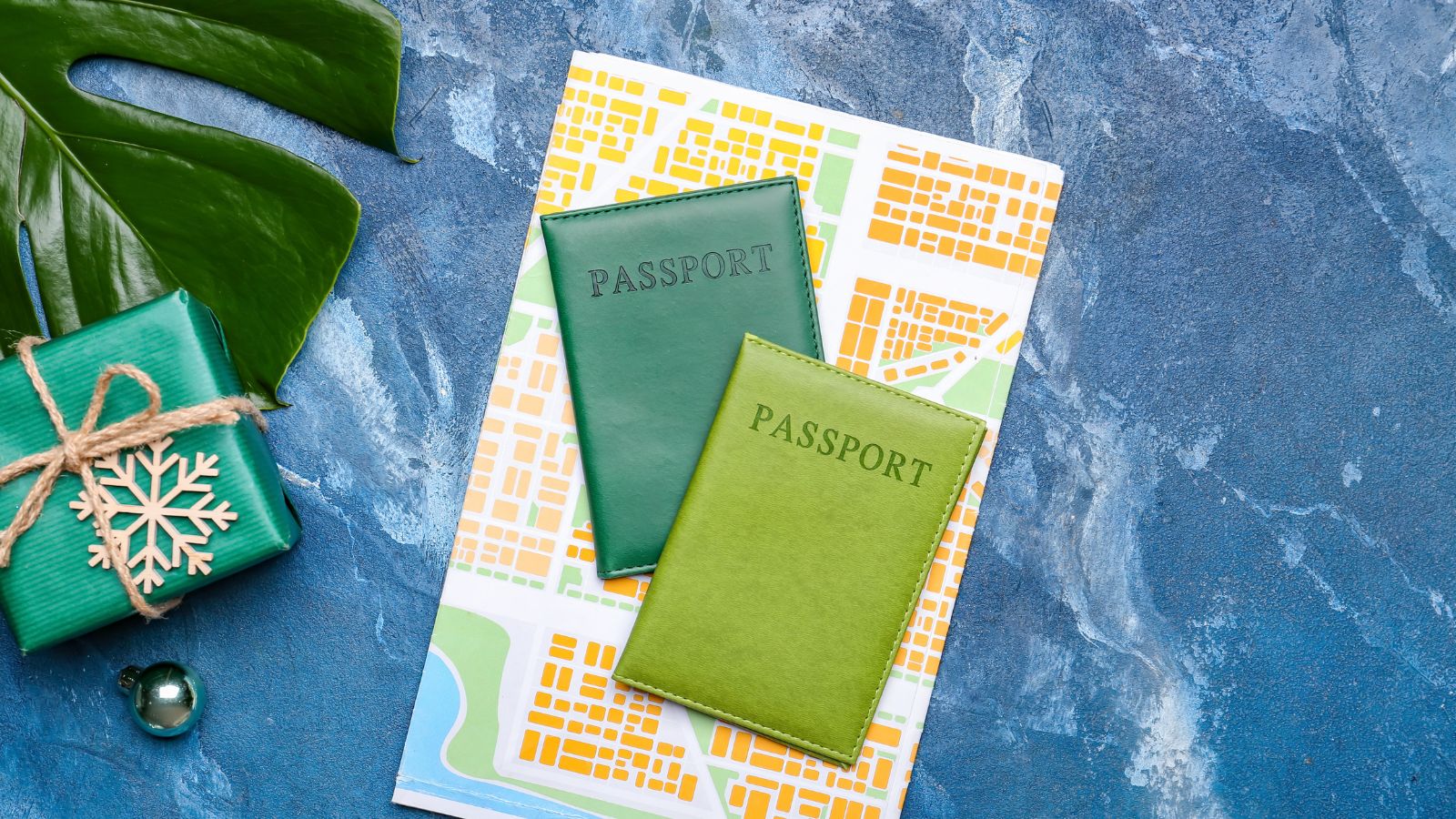 A photo of an Organized travel documents including two passports, flight itinerary, and notes arranged neatly on table.