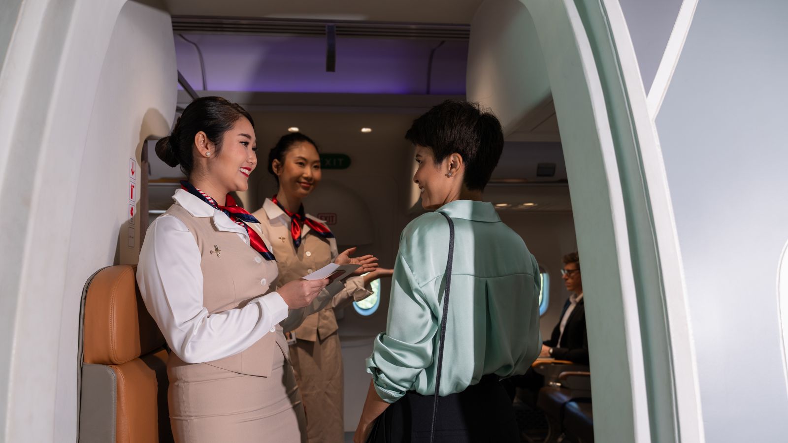 A photo of a passenger calmly exiting plane thanking cabin crew.