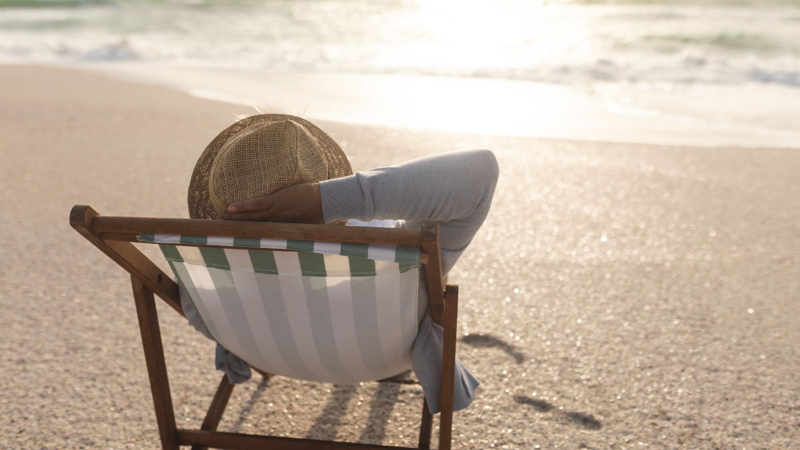 A photo of a relaxed traveler empty beach.