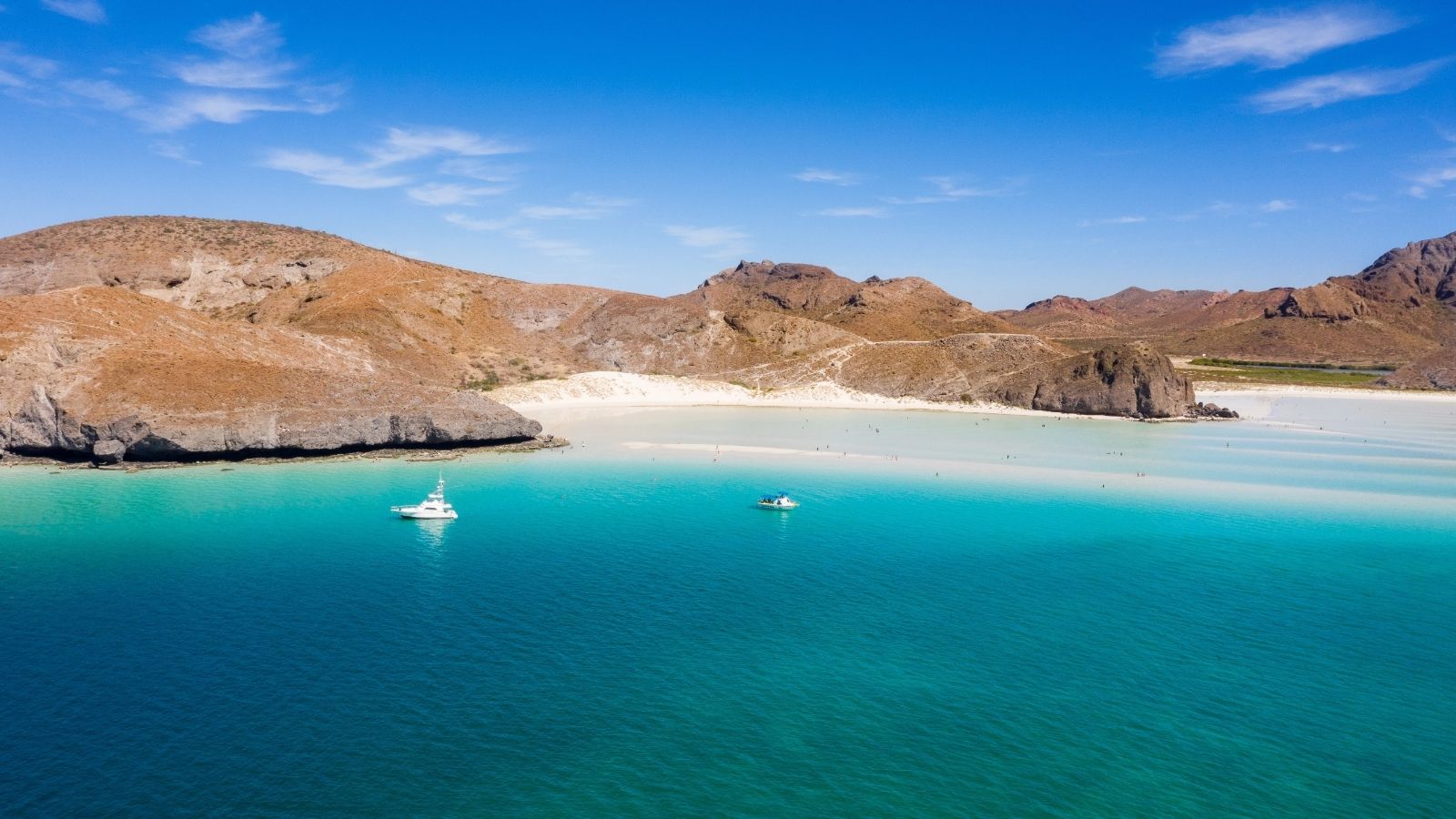Turquoise bay surrounded by desert hills at Playa Balandra in Baja California Sur.