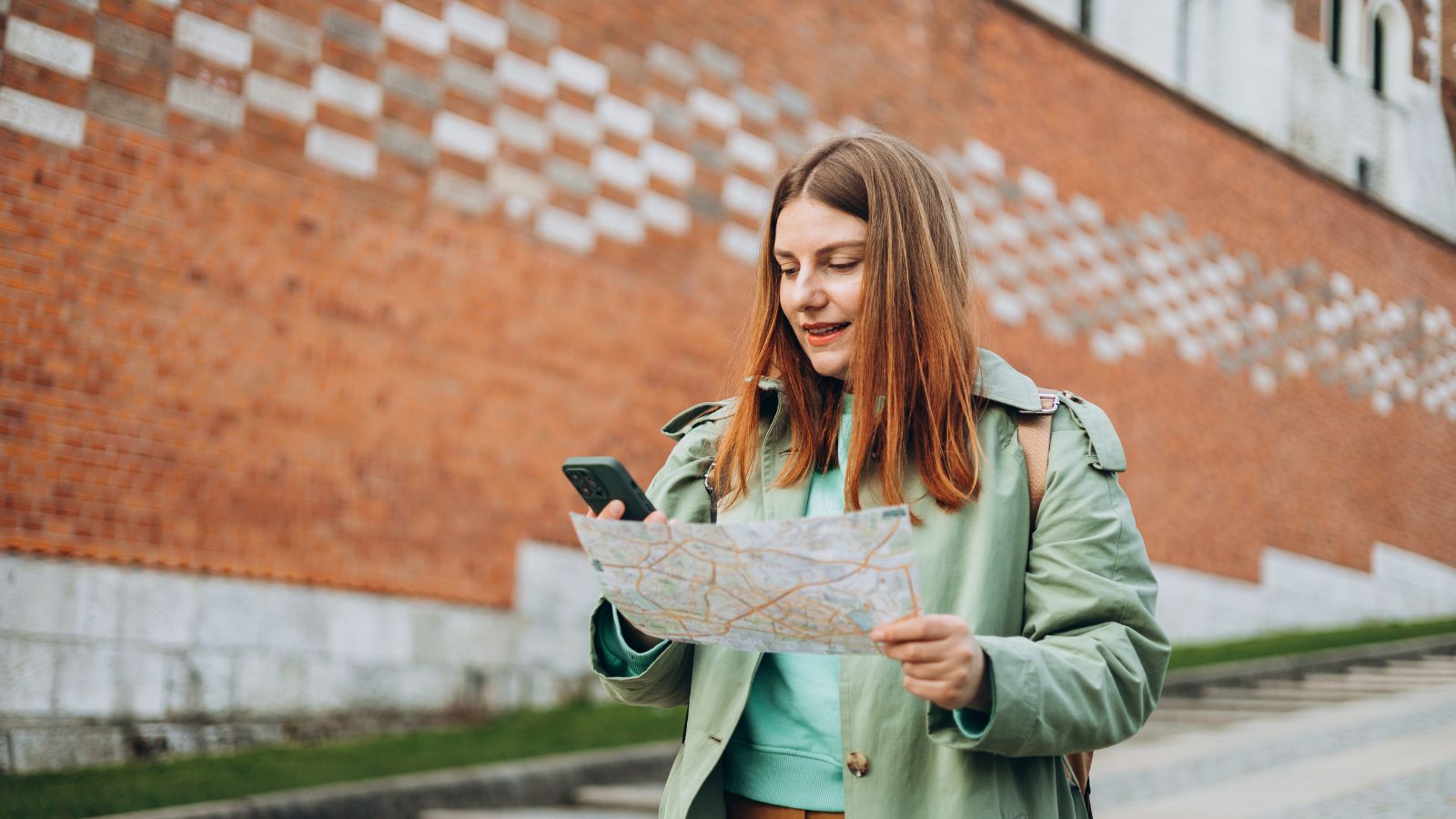 A photo of a woman looking at a map.