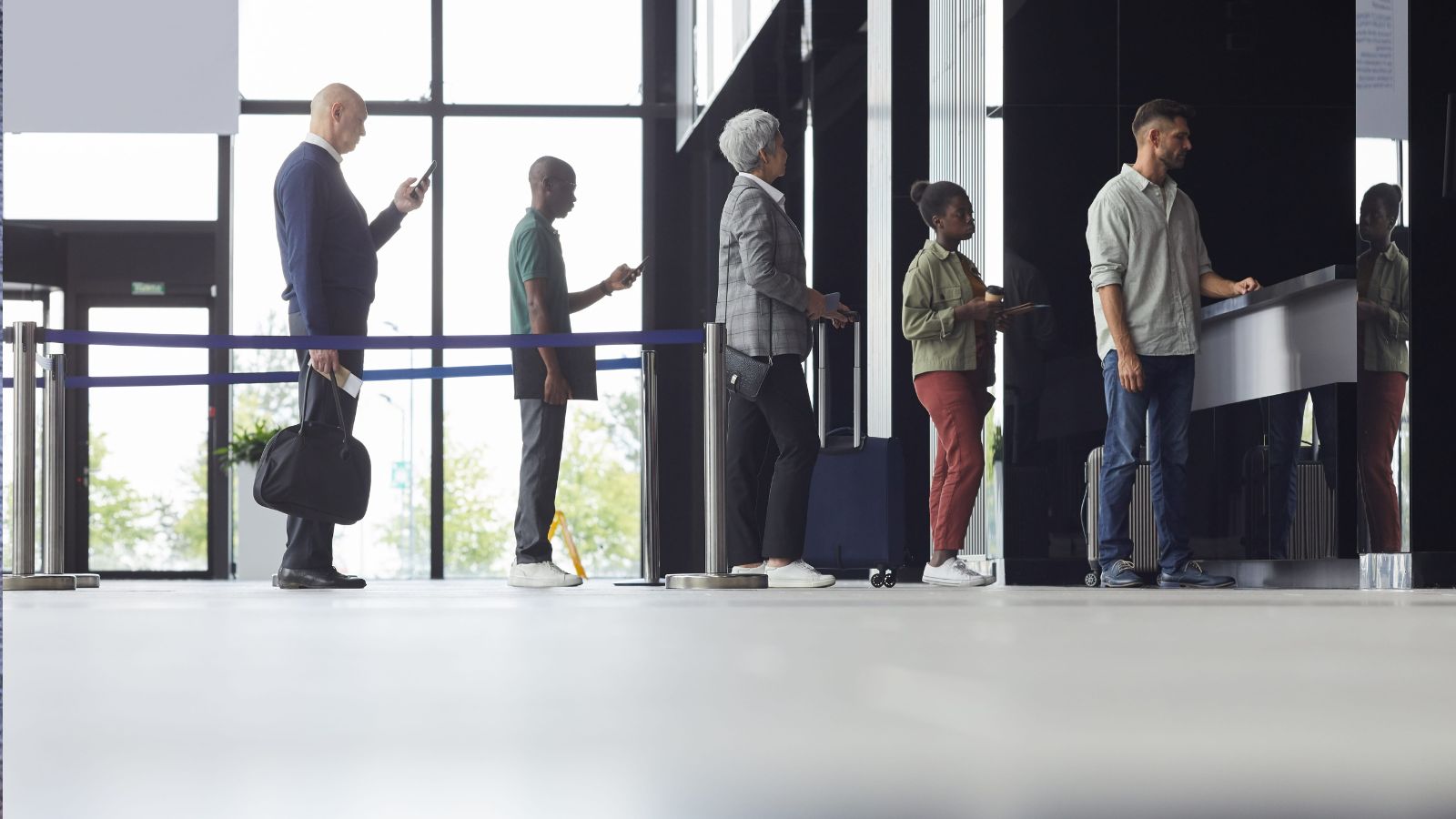 A photo that describes a peaceful early morning airport terminal with a few relaxed travelers boarding a flight, showing a smooth start to a trip.
