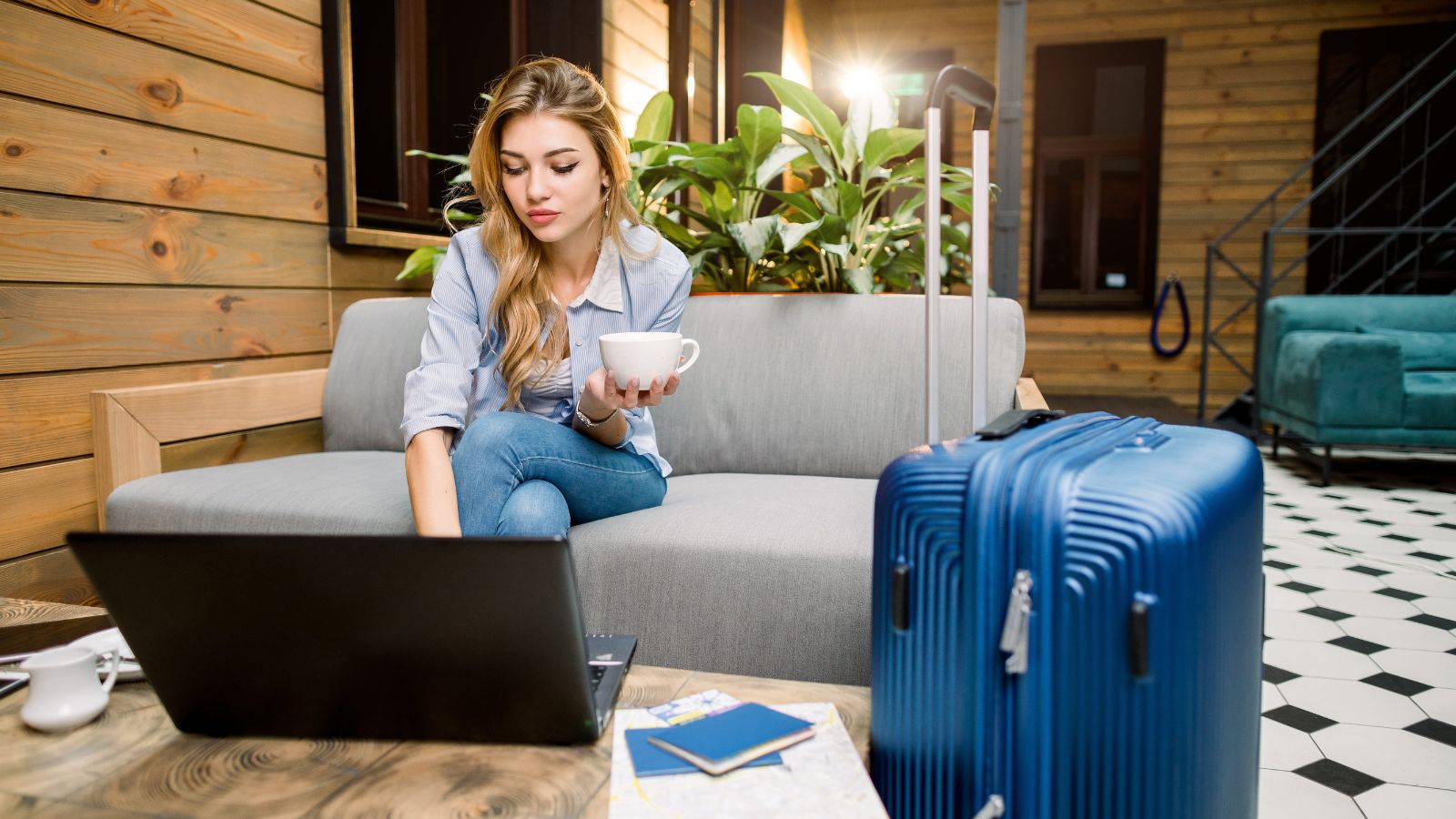 A photo of a woman checking something in her laptop