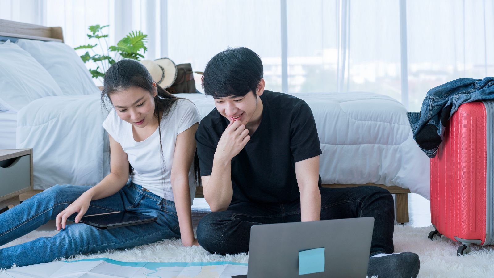 A photo of traveler comparing hotel options and prices on a laptop while planning a trip.