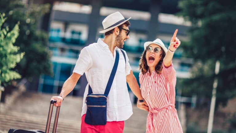 A photo of a couple traveler looking so excited.