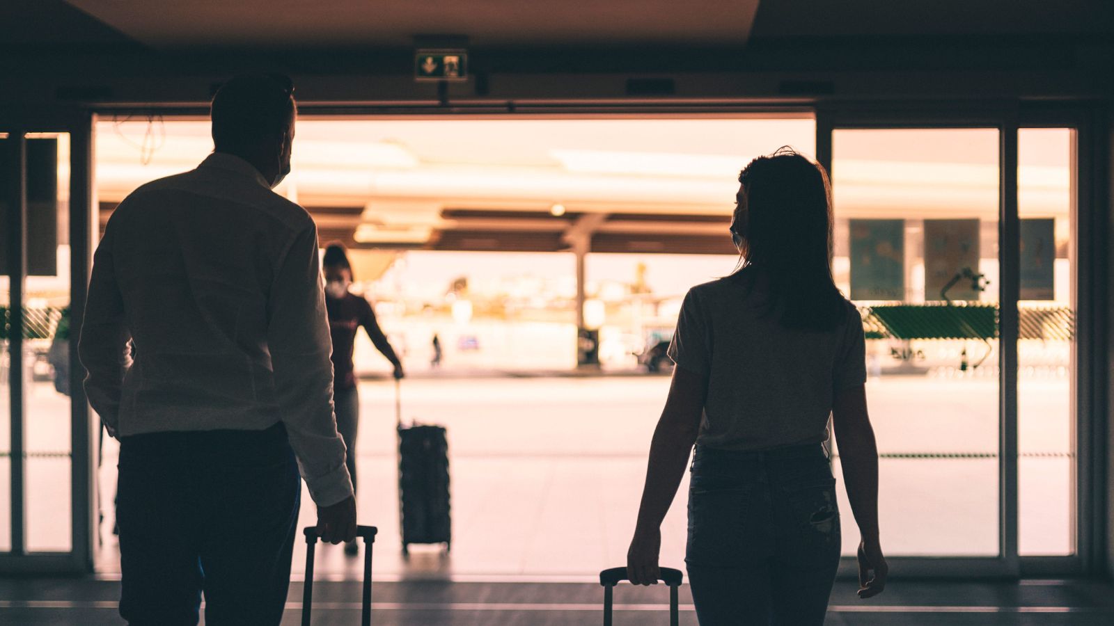 A photo of romantic couple arriving at peaceful hotel relaxed unhurried travel moment.