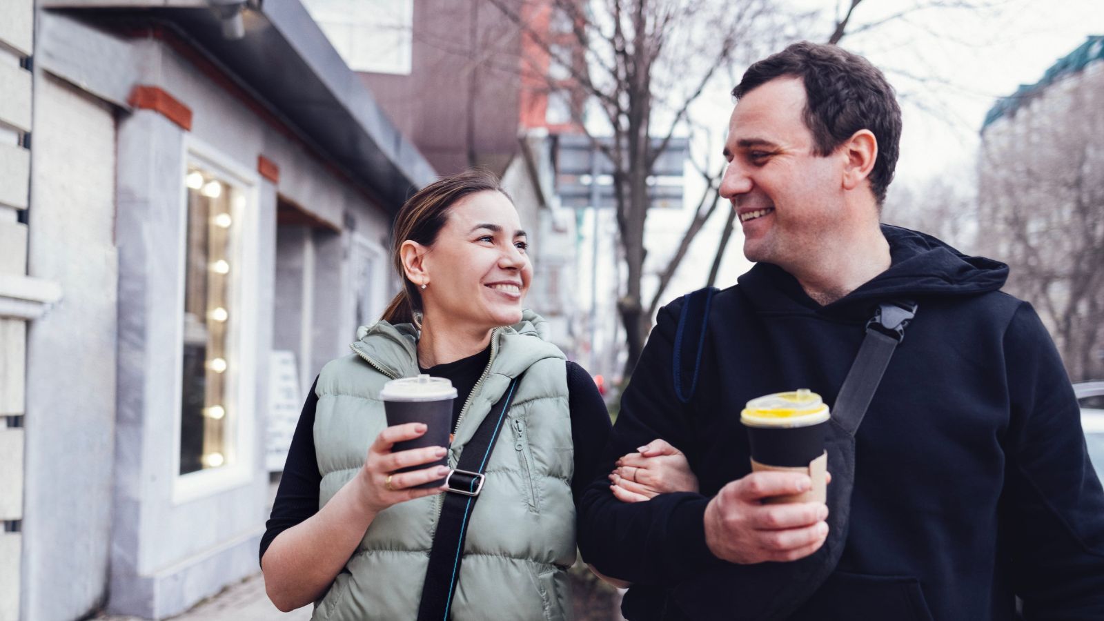A photo of omantic couple enjoying quiet coffee or slow walk together relaxed intimate moment simple travel experience.