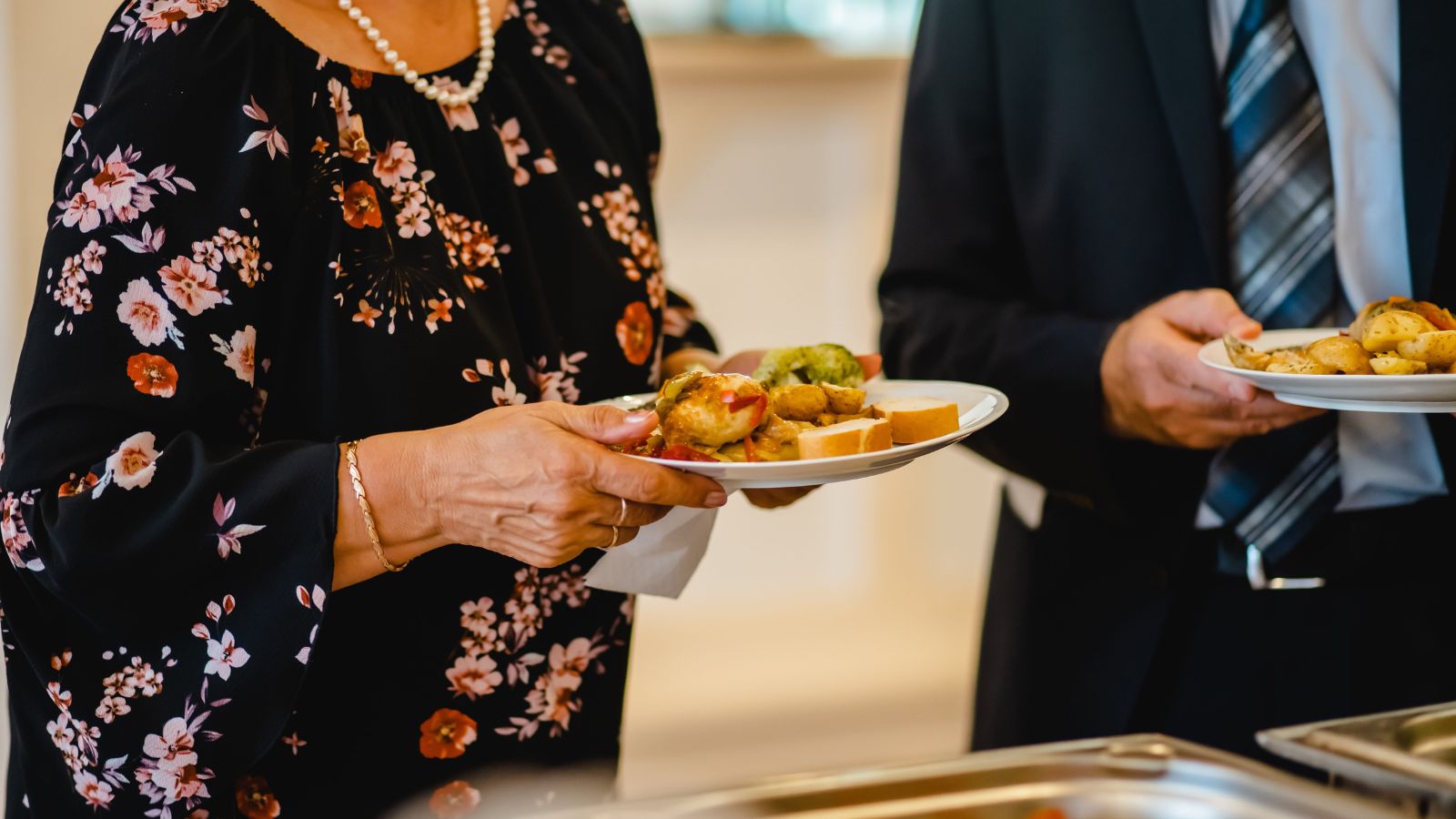 A photo showing busy cruise buffet area during peak brunch hour guests carrying plates.