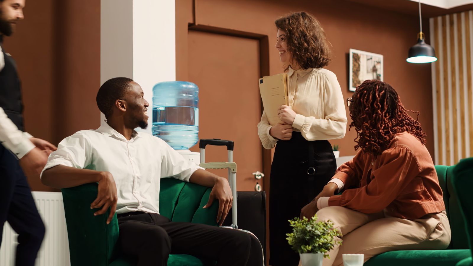 A photo of a traveler entering a small boutique hotel lobby with a calm and welcoming atmosphere.