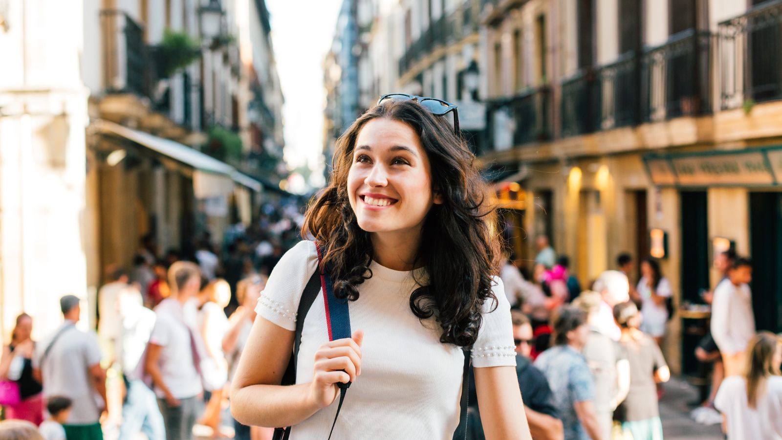 A photo of a traveler discovering a lively street market while wandering through a historic European city.
