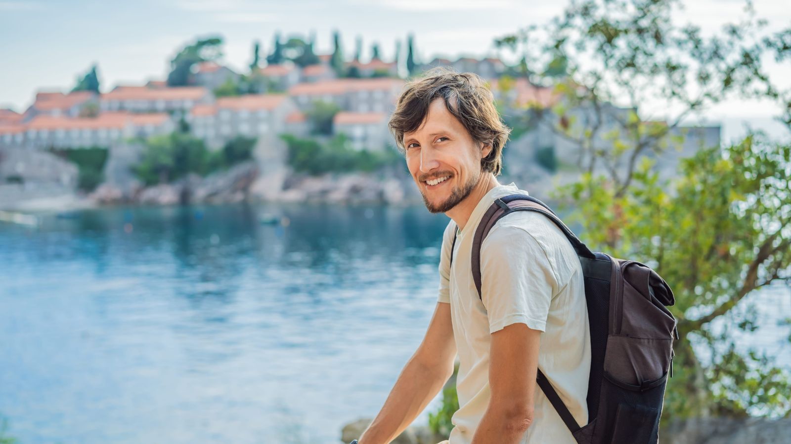 A photo of a man smiling.