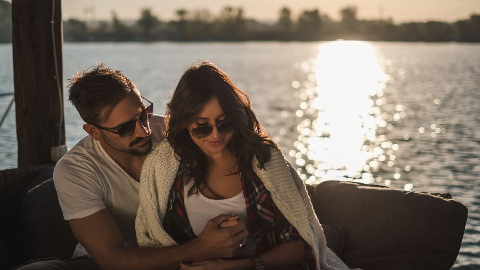 A photo of a romantic couple relaxing together peaceful setting slow travel enjoying each other no rush intimate connection natural light candid.