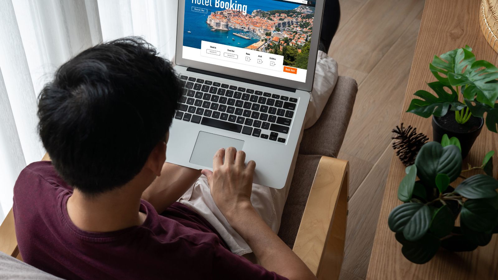A photo of a traveler browsing hotel room options on laptop or phone comparing upgrade choices modern hotel booking concept clean aesthetic.