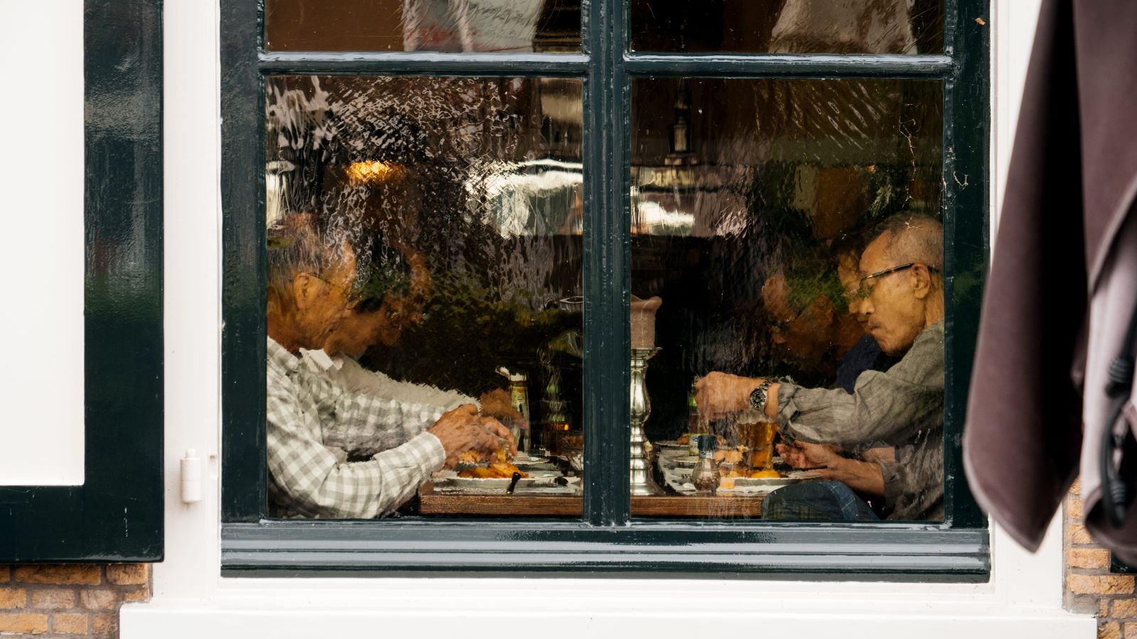 A photo of a travelers enjoying a relaxed dinner at a cozy neighborhood restaurant close to their hotel.