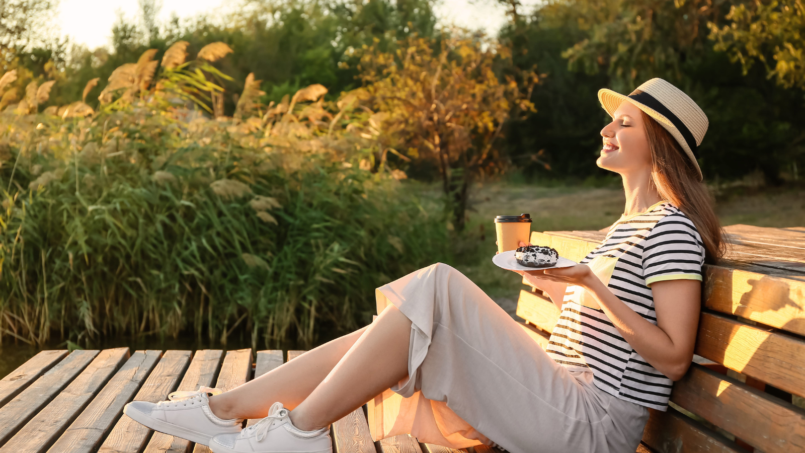 A photo of a traveler enjoying slow morning breakfast or calm evening walk relaxed travel routine peaceful natural light candid.