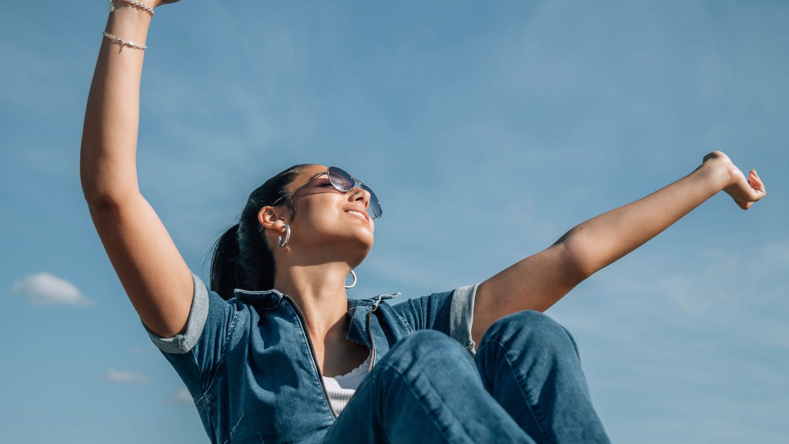 A photo of a traveler enjoying spontaneous travel moment relaxed smiling no schedule peaceful atmosphere natural light.