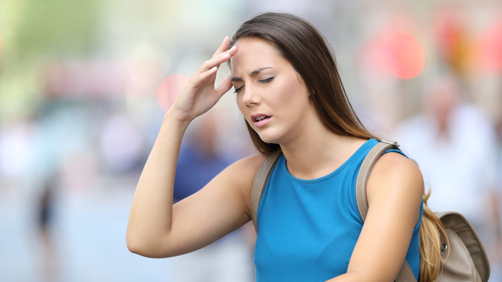 A photo of a exhausted tourist walking in crowded city looking tired and overwhelmed busy travel schedule fatigue candid realistic.