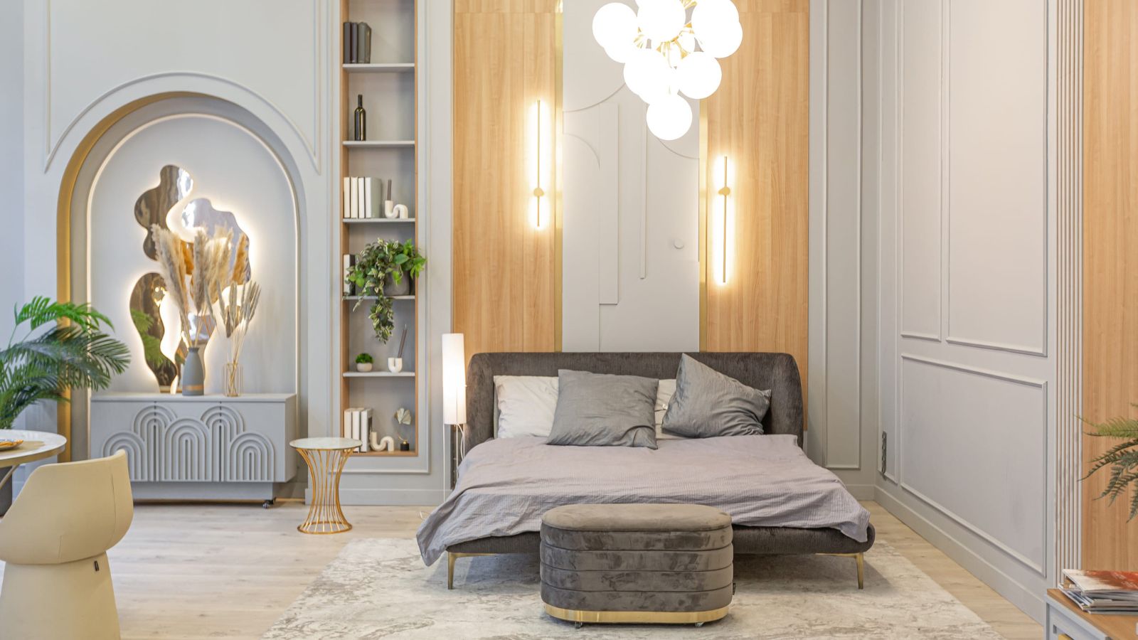 A photo of spacious quiet hotel room with comfortable bed soft lighting seating area relaxing atmosphere high quality interior design natural light.