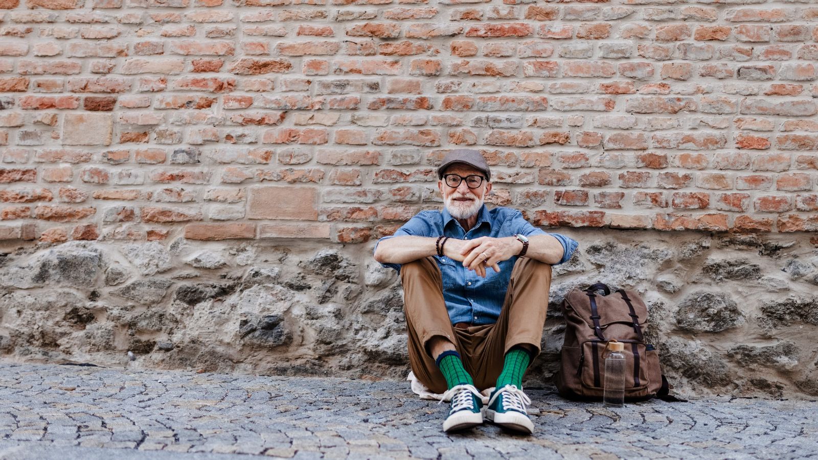 A photo of a tired tourist sitting or walking in busy city looking exhausted crowded travel fatigue candid realistic.