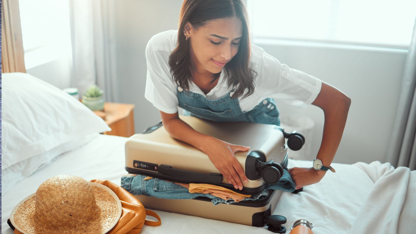 A photo of a woman packing in the bed